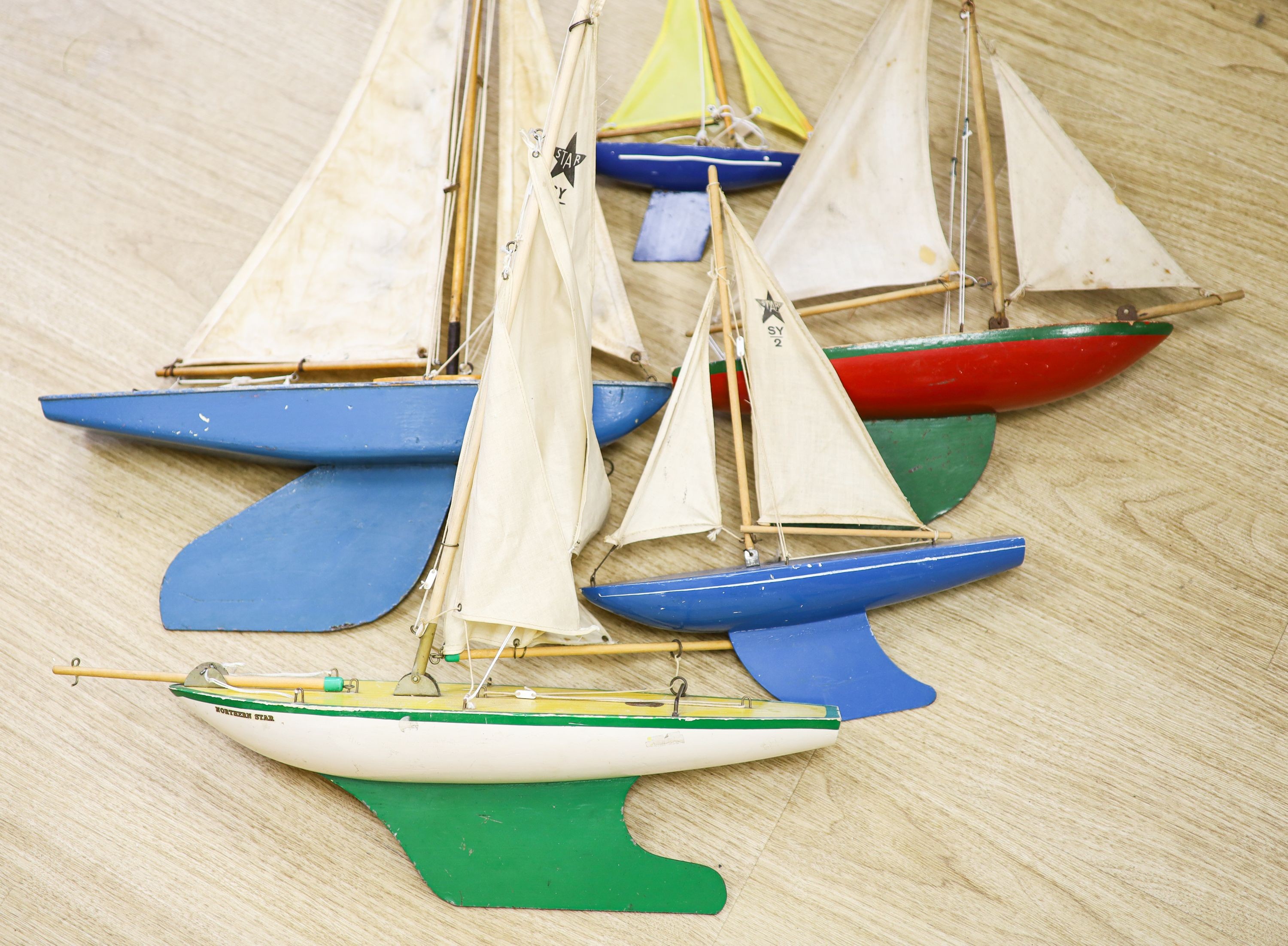 A group of five painted wood pond yachts